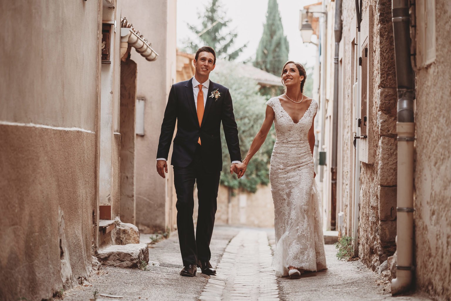 Couple walking through a village street