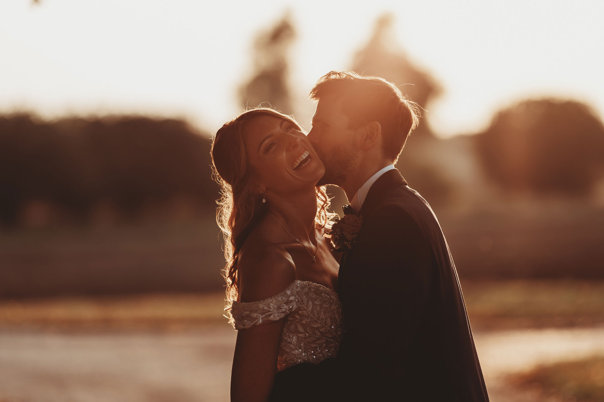 documentary wedding photography — couple at sunset, golden hour