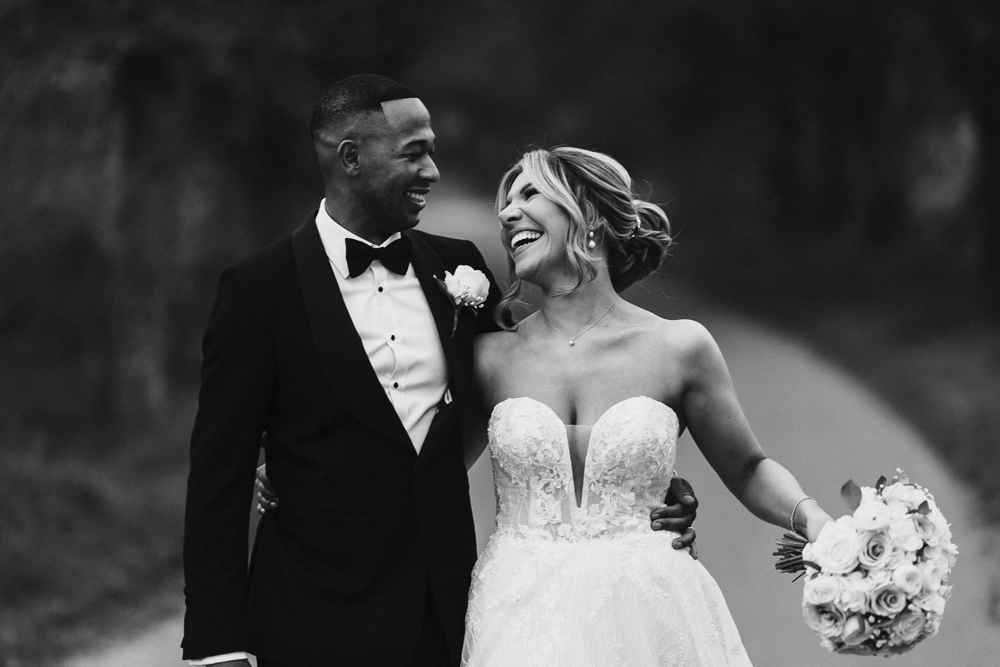 documentary wedding photography — couple laughing, black and white