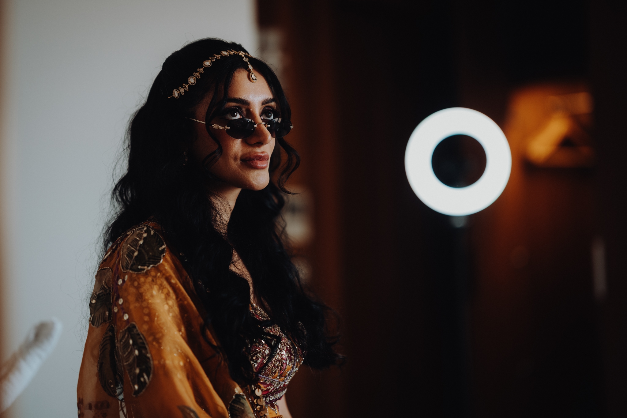Lakshna & Neil / The Hilton, Malta 10 Bride and groom in golden lotus pods at their Haldi — Malta wedding photographer