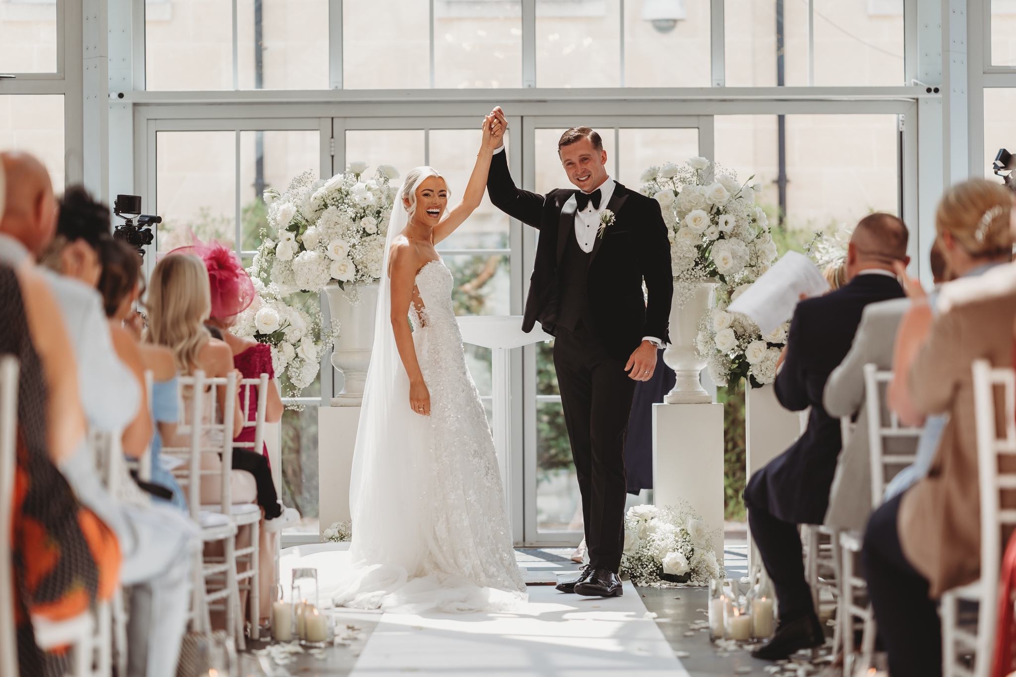 Wedding ceremony in the glasshouse at Botleys Mansion, Chertsey