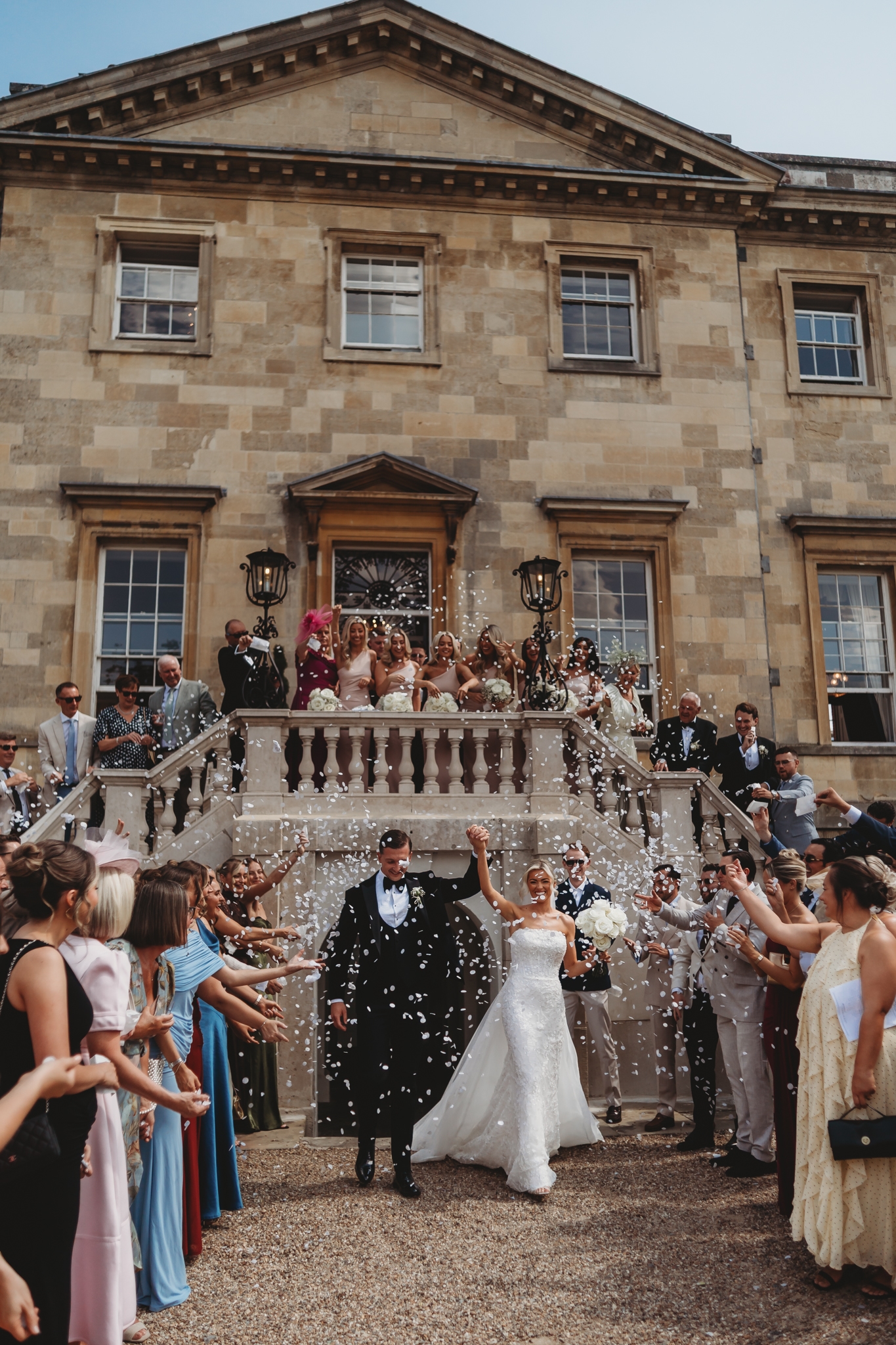Confetti on the grand staircase at a Botleys Mansion wedding