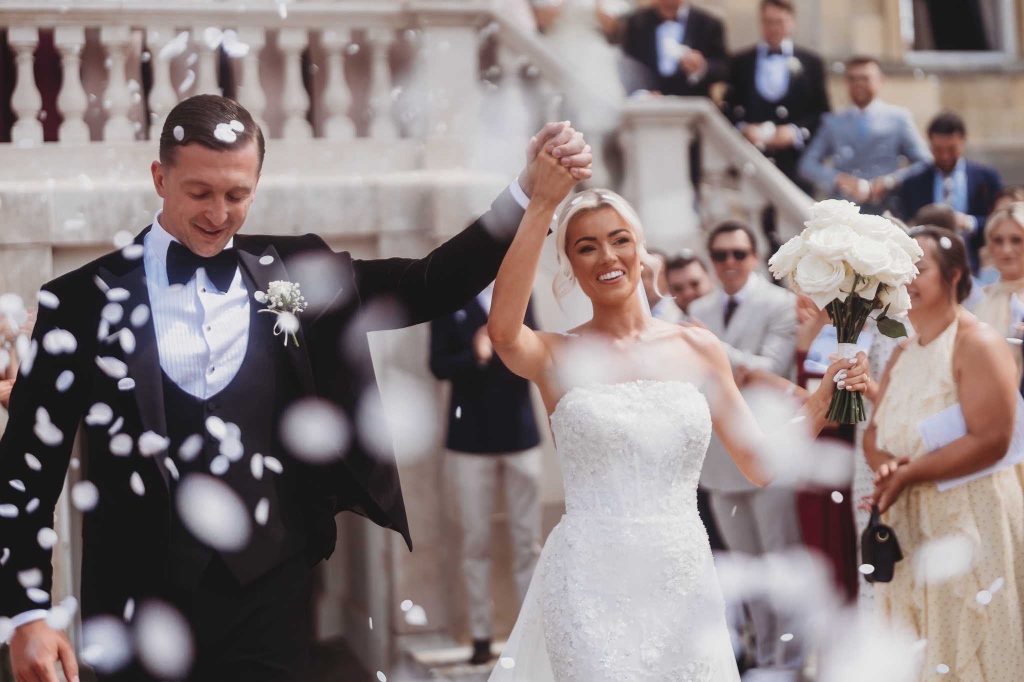 Confetti on the grand staircase at a Botleys Mansion wedding
