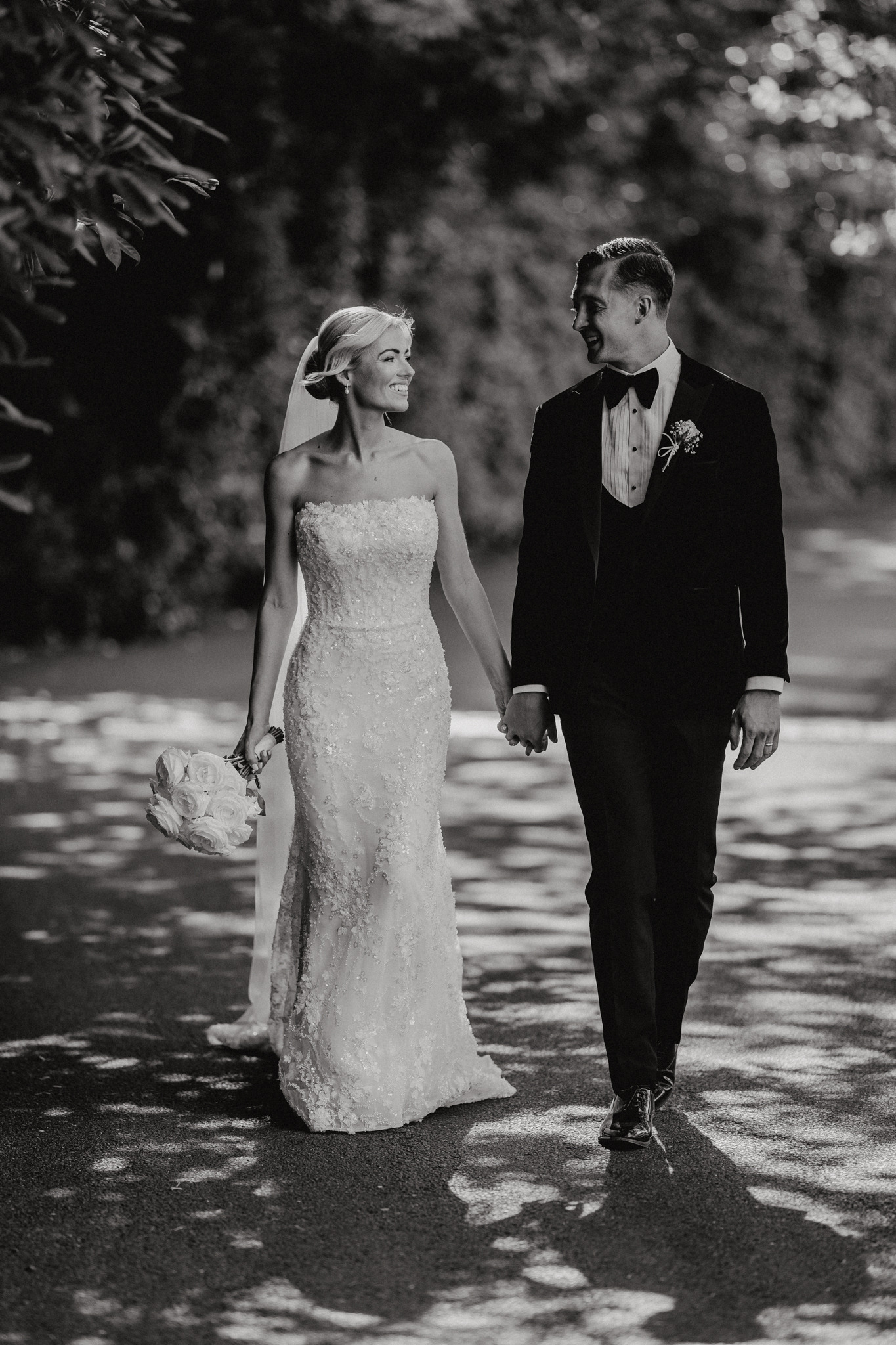 Bride and groom on the sweeping stairs of Botleys Mansion, Surrey
