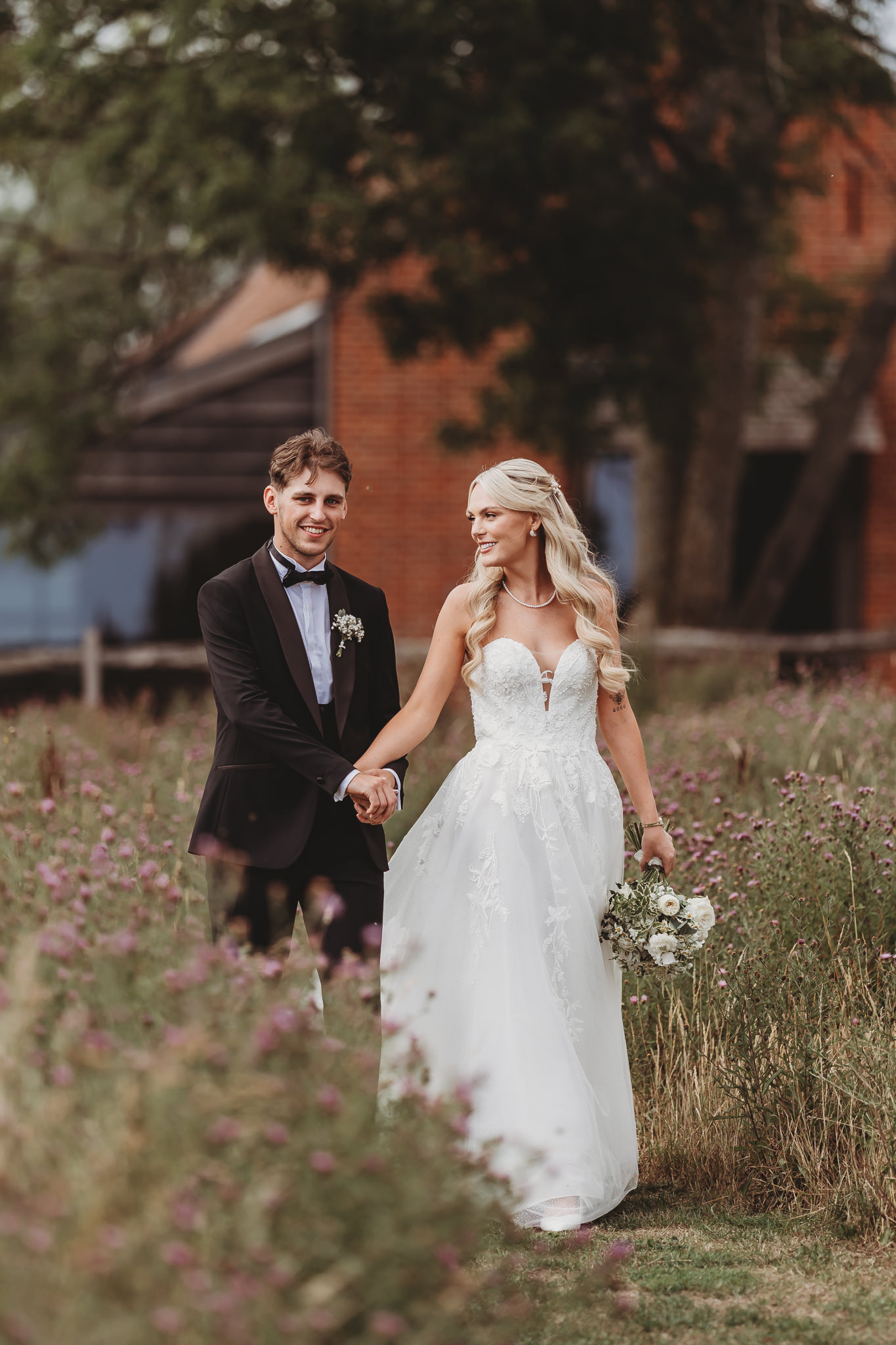 Ella & Ryan / Rackleys Barn 20 Bride and groom in the wildflower meadow at a Rackleys Barn wedding