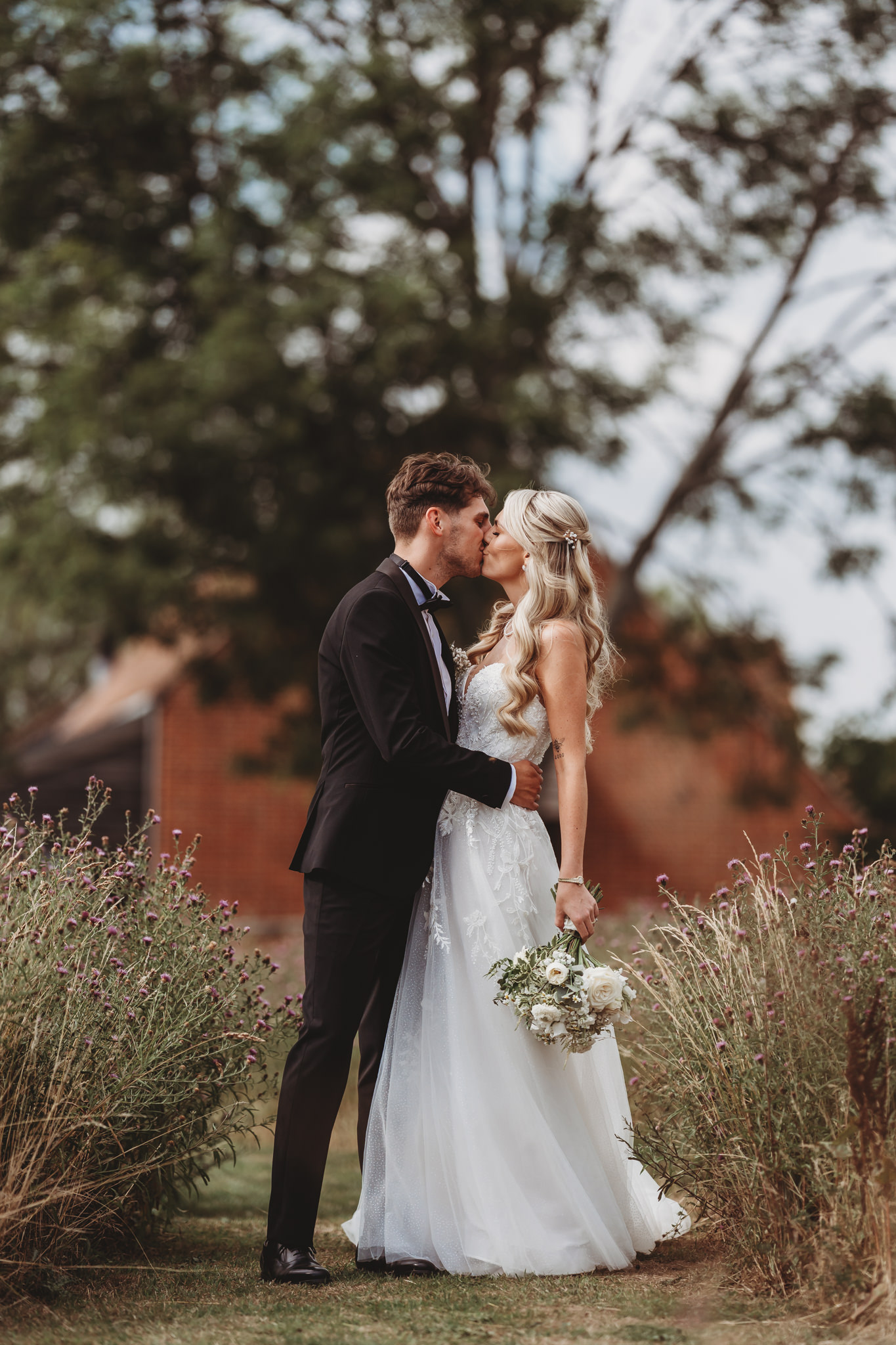 Ella & Ryan / Rackleys Barn 21 Bride and groom in the wildflower meadow at a Rackleys Barn wedding