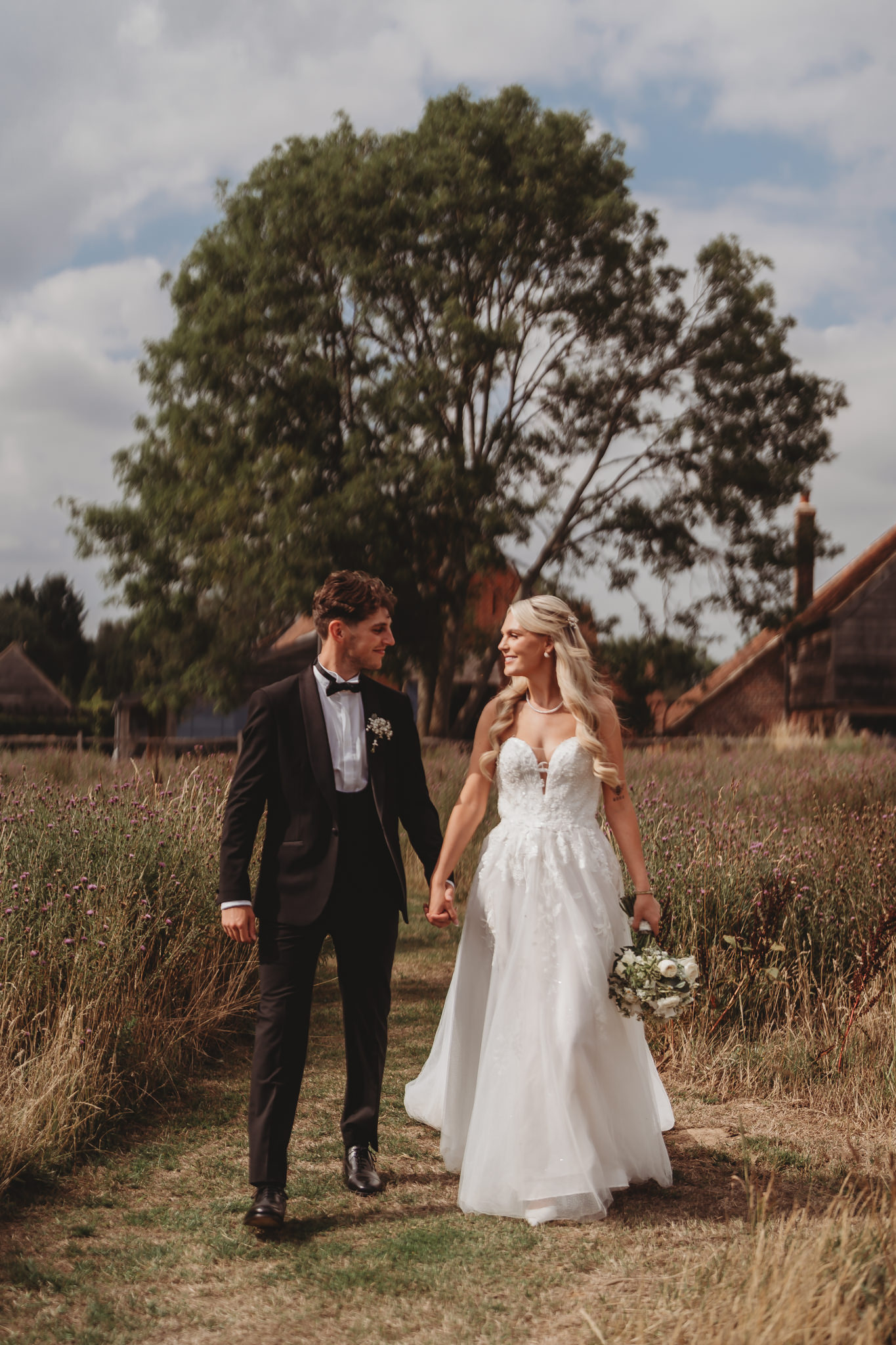Ella & Ryan / Rackleys Barn 22 Bride and groom in the wildflower meadow at a Rackleys Barn wedding