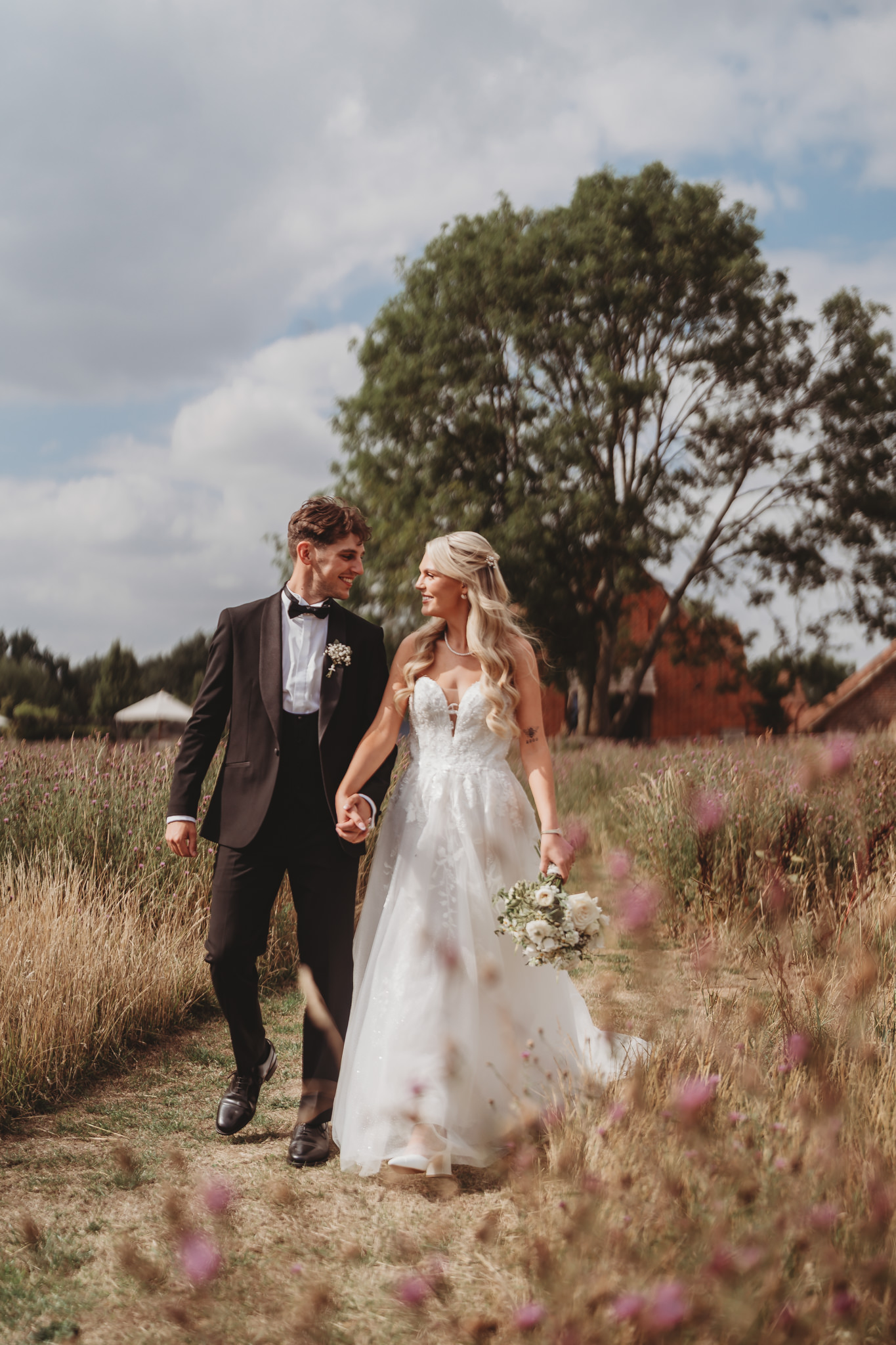 Ella & Ryan / Rackleys Barn 23 Bride and groom in the wildflower meadow at a Rackleys Barn wedding