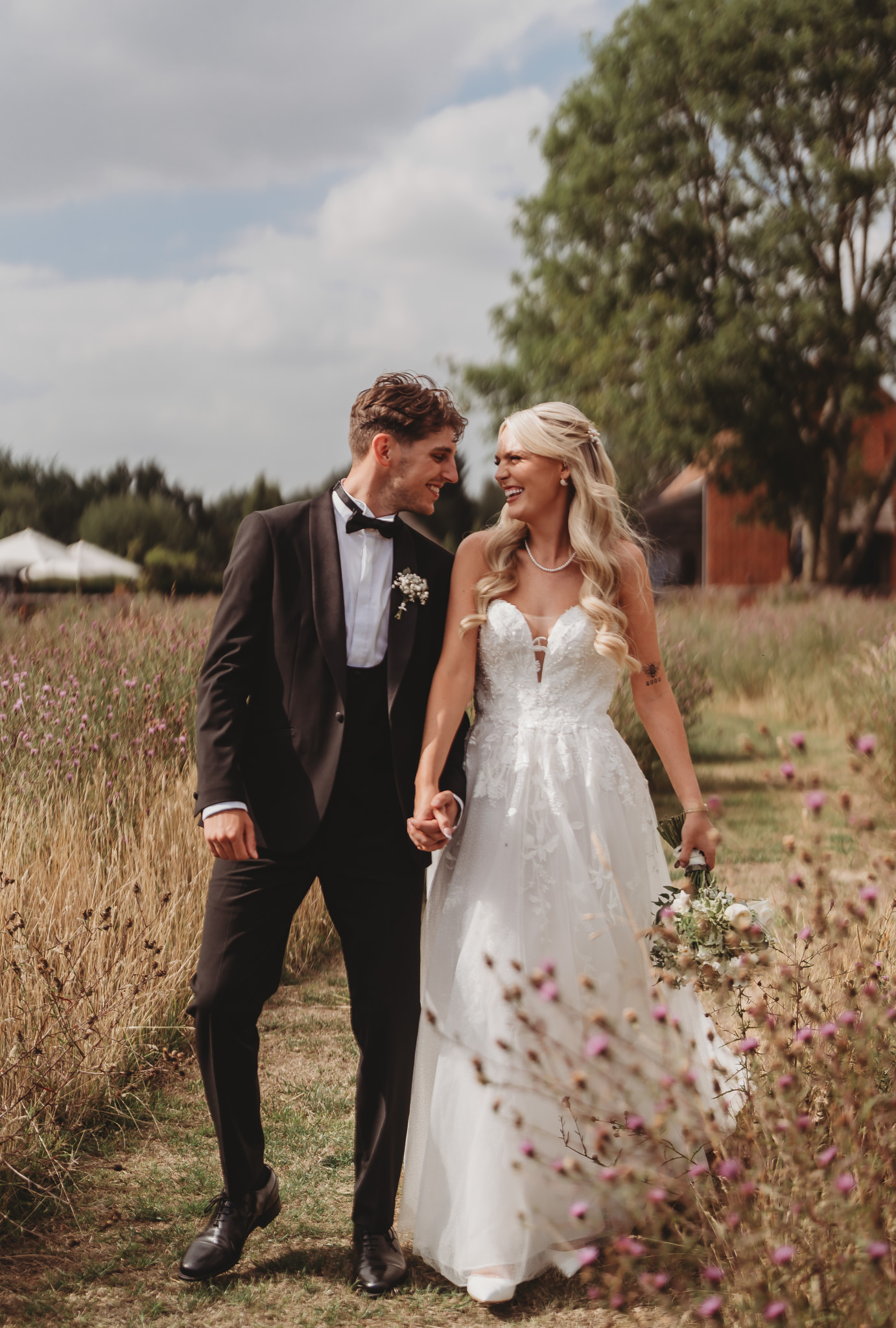 Ella & Ryan / Rackleys Barn 24 Bride and groom in the wildflower meadow at a Rackleys Barn wedding