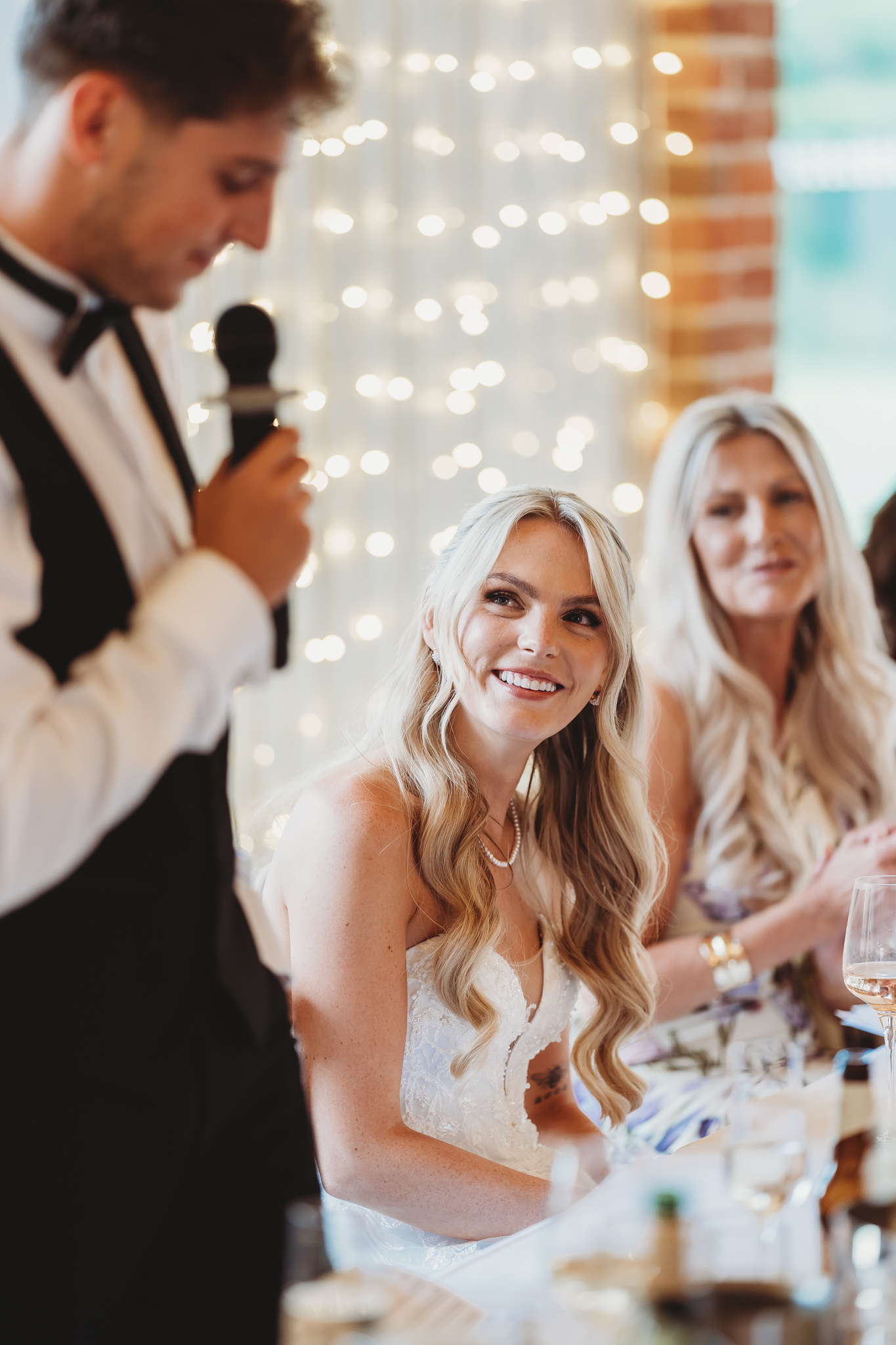 Ella & Ryan / Rackleys Barn 40 Wedding speeches under festoon lights at Rackleys Barn — Buckinghamshire wedding photographer