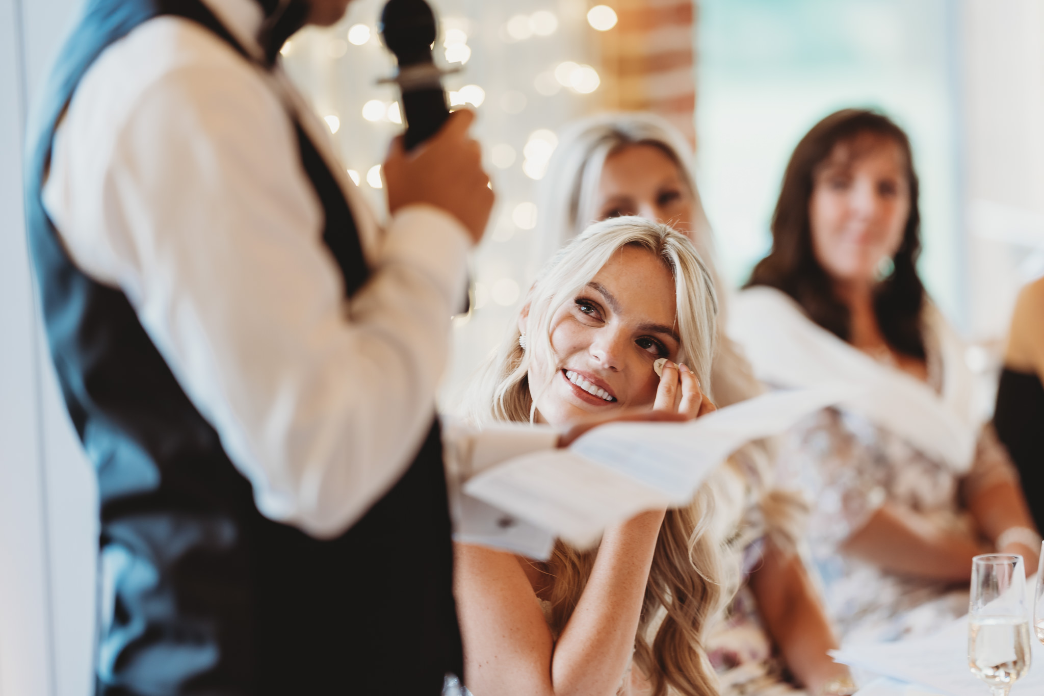 Ella & Ryan / Rackleys Barn 42 Wedding speeches under festoon lights at Rackleys Barn — Buckinghamshire wedding photographer