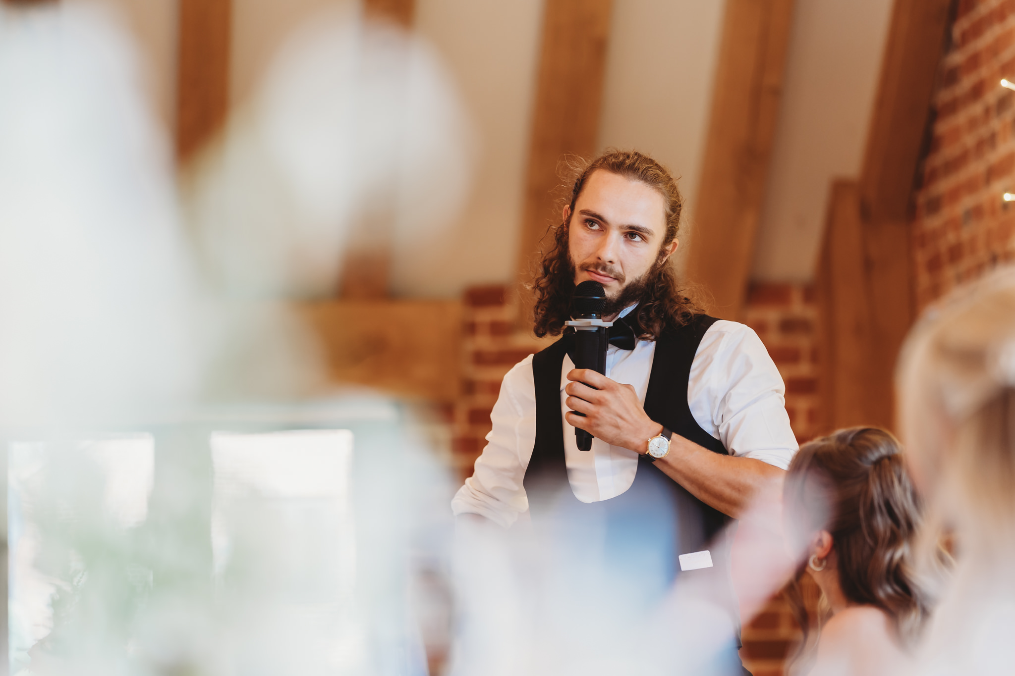 Ella & Ryan / Rackleys Barn 47 Wedding speeches under festoon lights at Rackleys Barn — Buckinghamshire wedding photographer