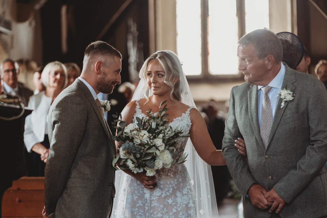 Bride walking down the aisle with her dad