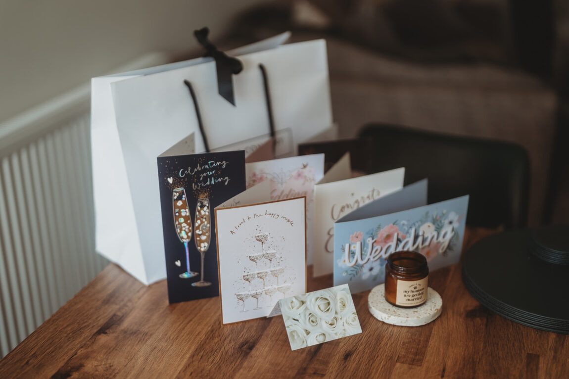 Barnston Lodge wedding: Wedding morning gifts and cards laid out on a table