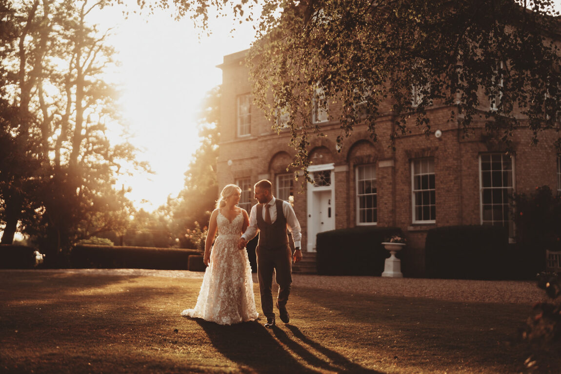 Sarah and Daniel at golden hour in front of Barnston Lodge