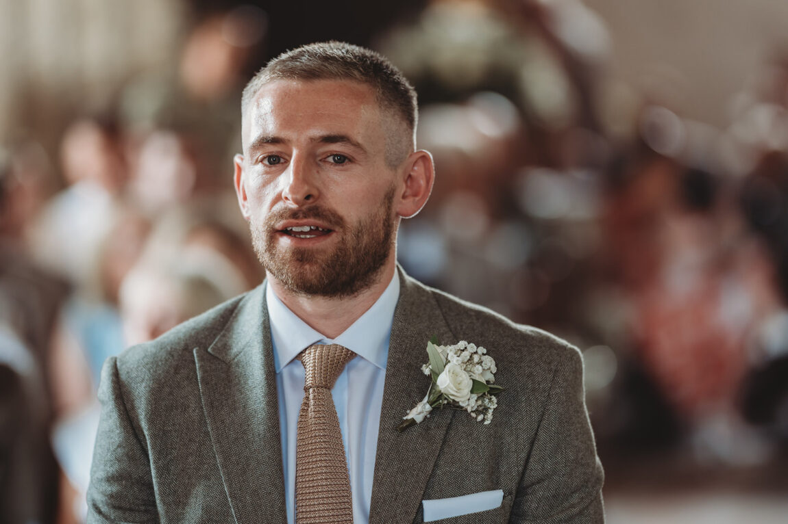 Groom waiting at the front of the church