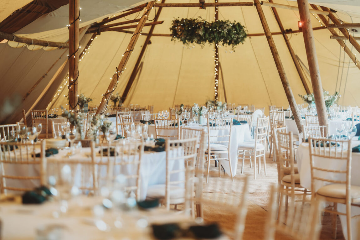 Inside the tipis laid for the wedding breakfast at Barnston Lodge