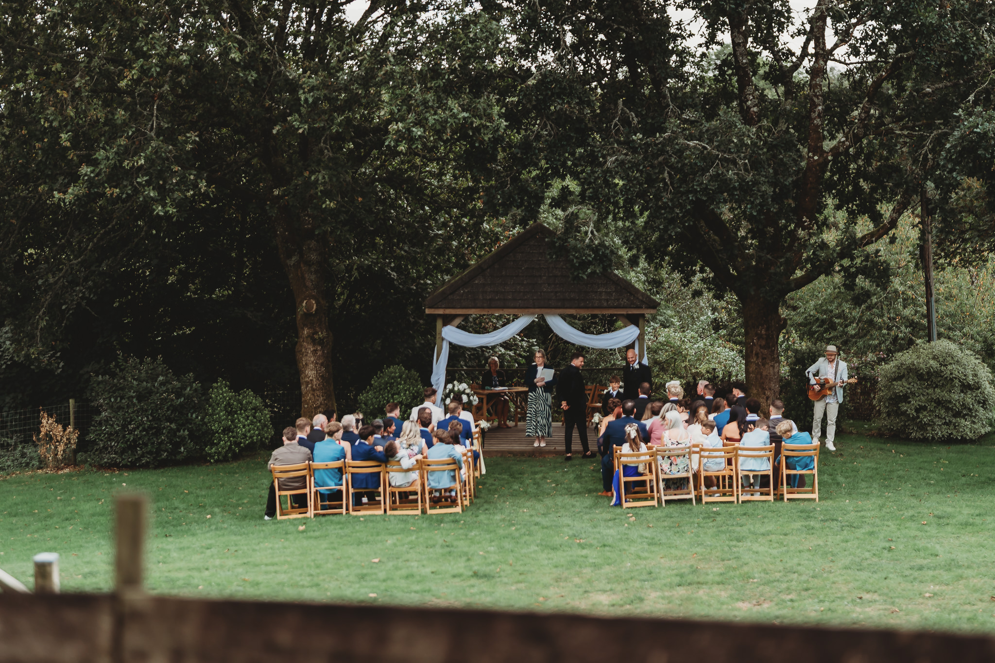 An outdoor wedding ceremony at the oak arbour, The Green Cornwall, Liskeard