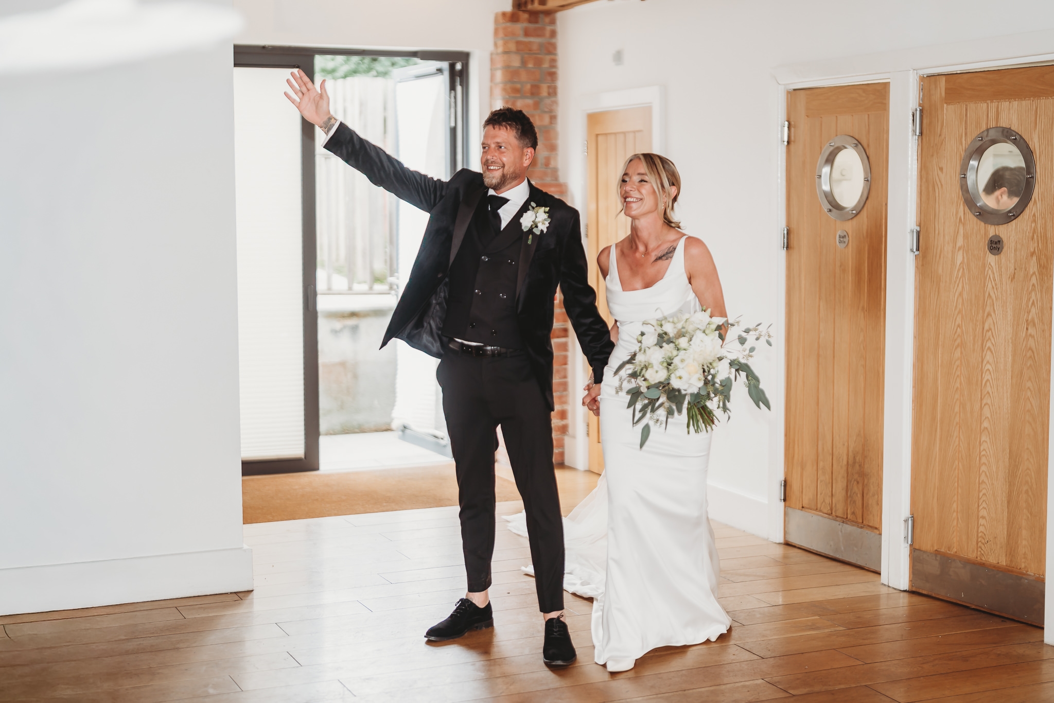 Laura & Liam / The Green Cornwall 26 Laura and Liam entering the barn to cheers from their guests