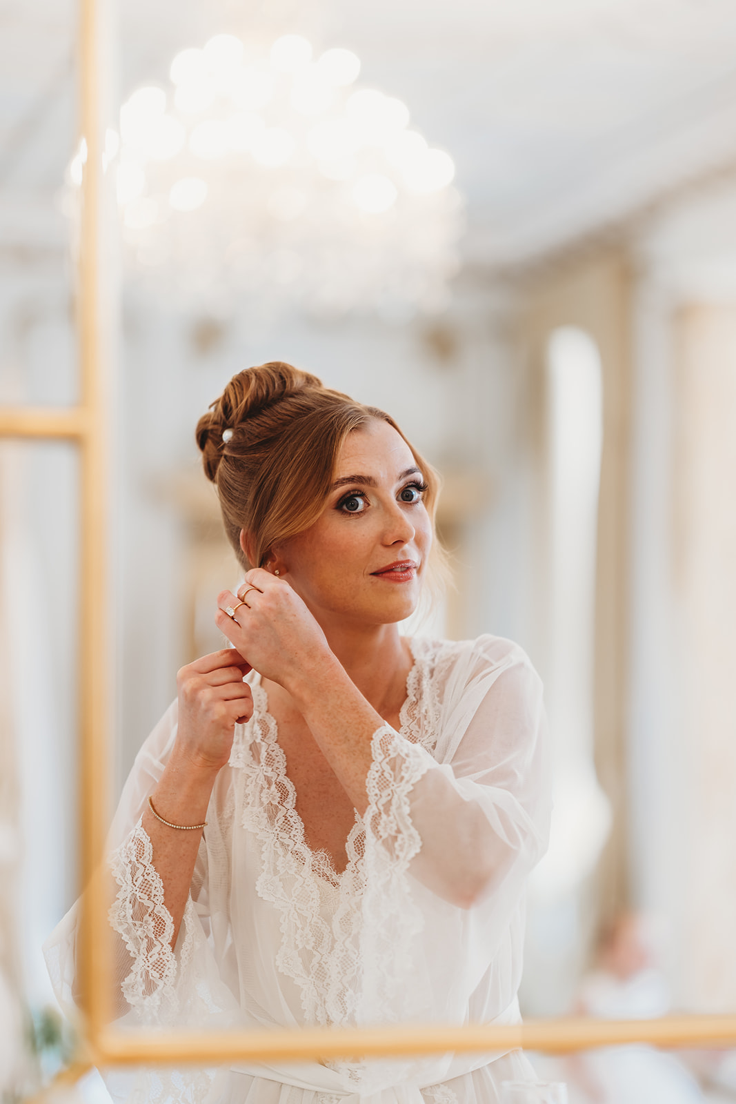 Bride ready for her Gosfield Hall wedding, with a first look from her dad
