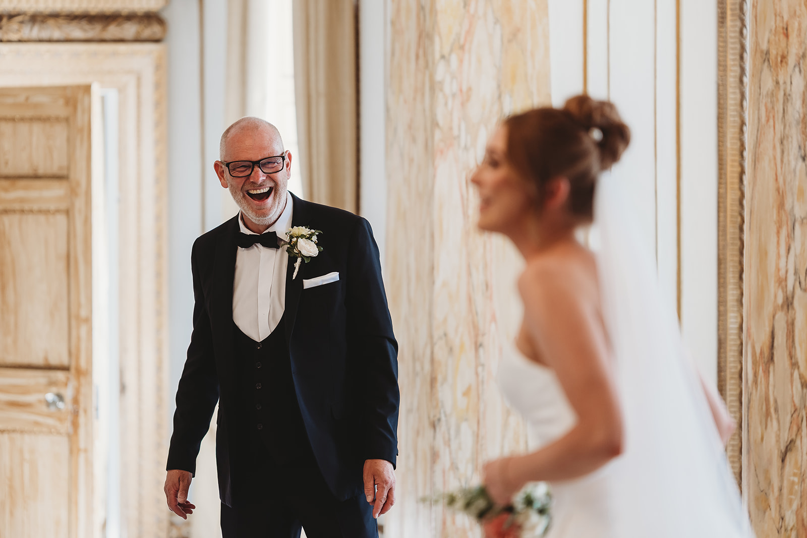 Bride ready for her Gosfield Hall wedding, with a first look from her dad