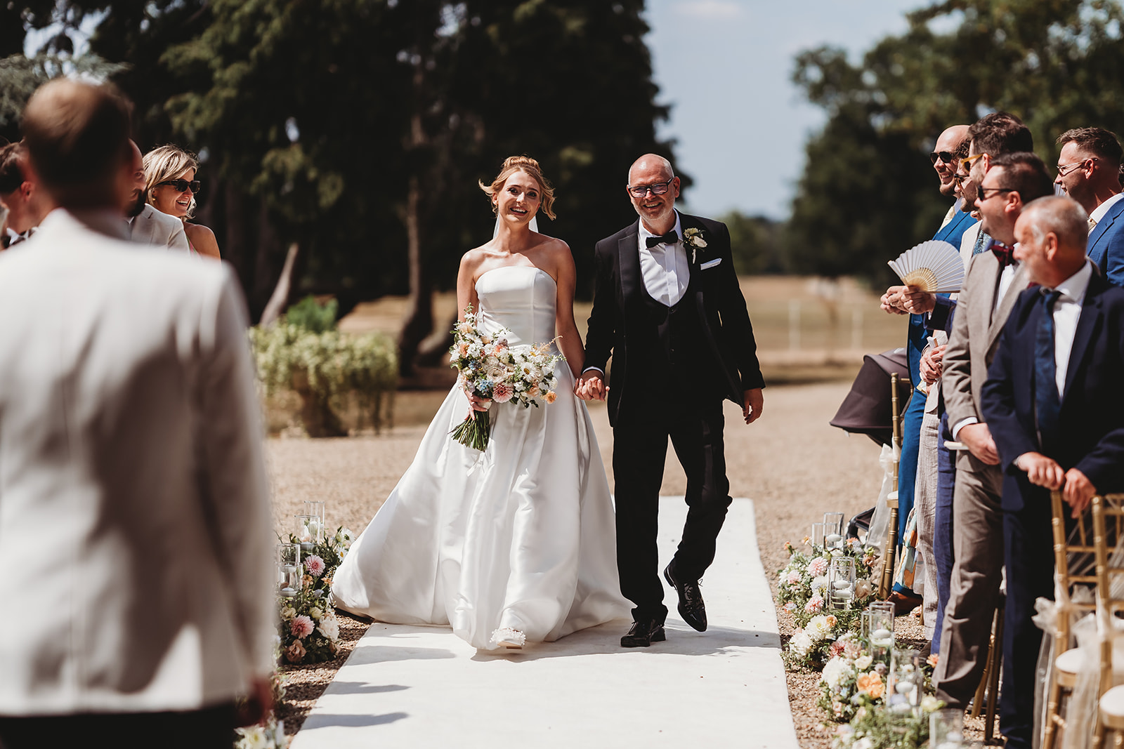 Outdoor wedding ceremony at Gosfield Hall, Essex