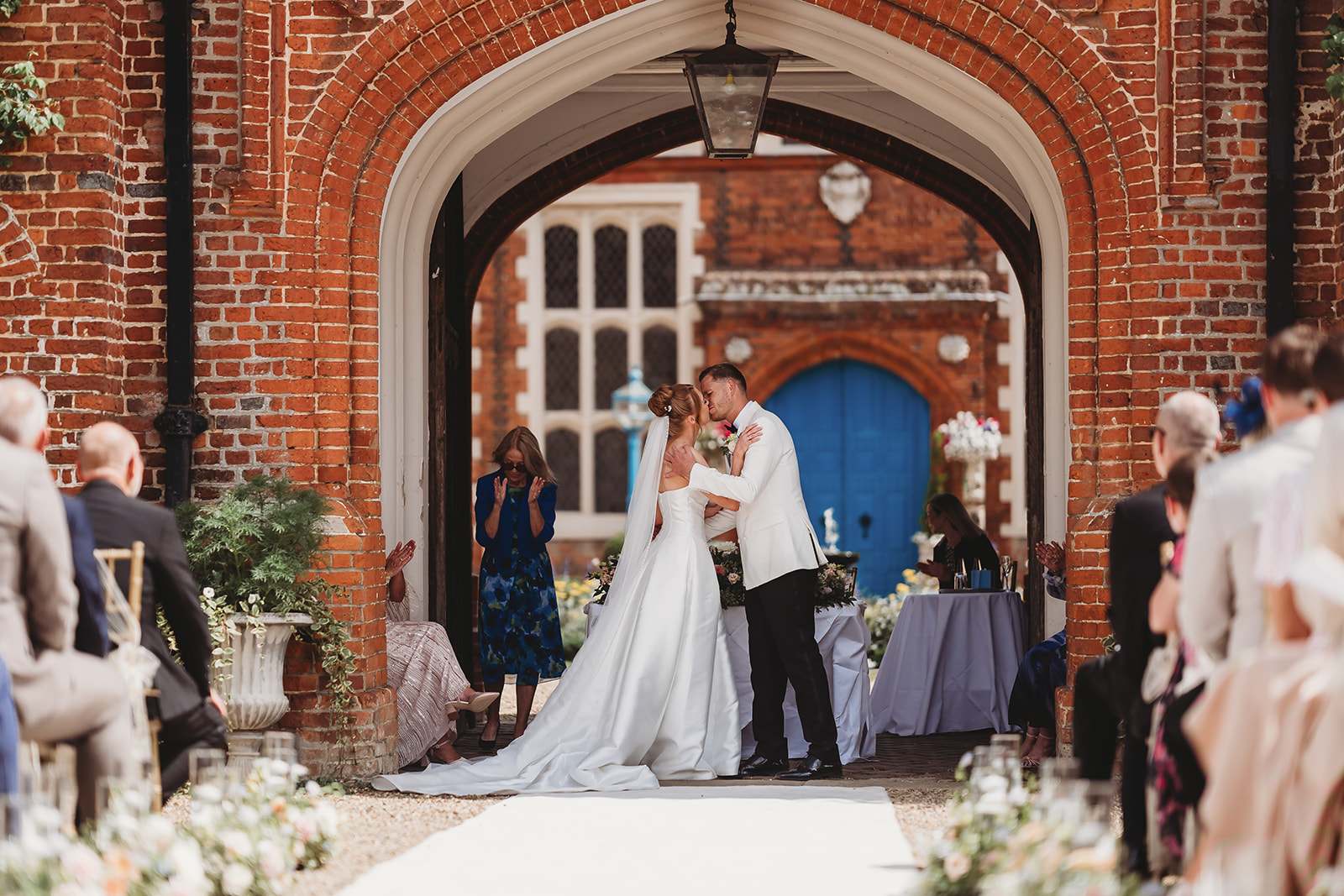 Outdoor wedding ceremony at Gosfield Hall, Essex