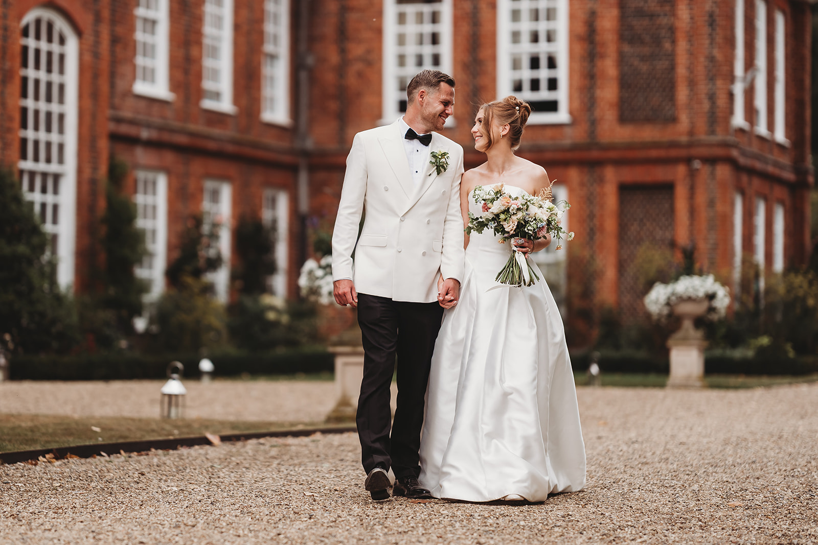 Couple portraits around Gosfield Hall in Essex