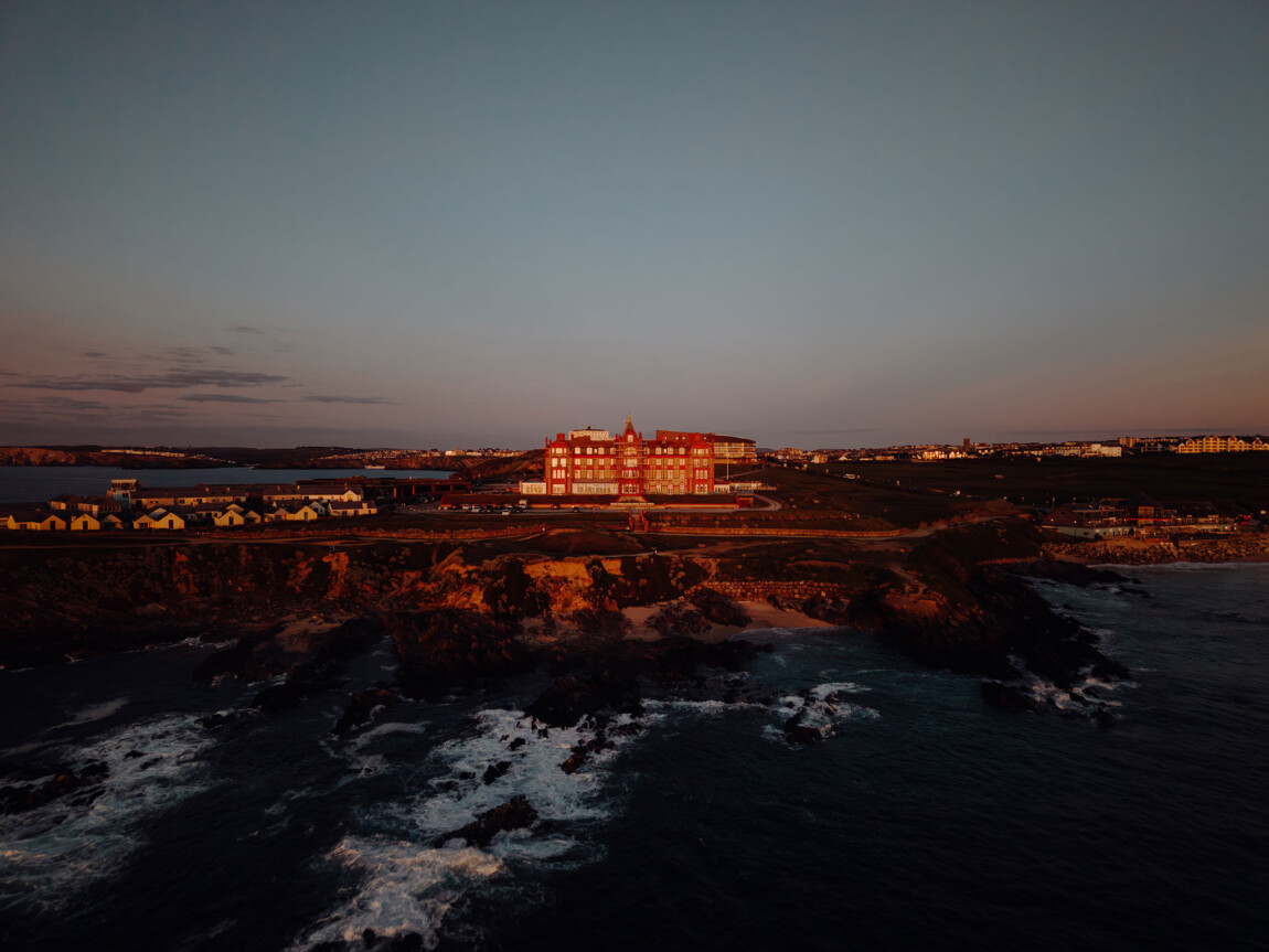 Drone photo of the Headland Hotel above Fistral Beach at dusk