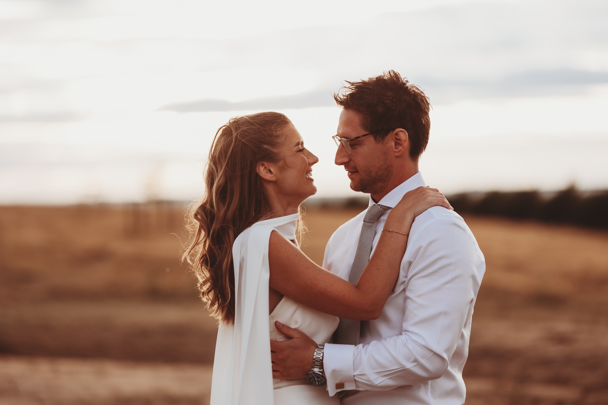 Rosevine wedding photographer Matt Wing, a photo from another wedding: bride and groom embracing in soft evening light