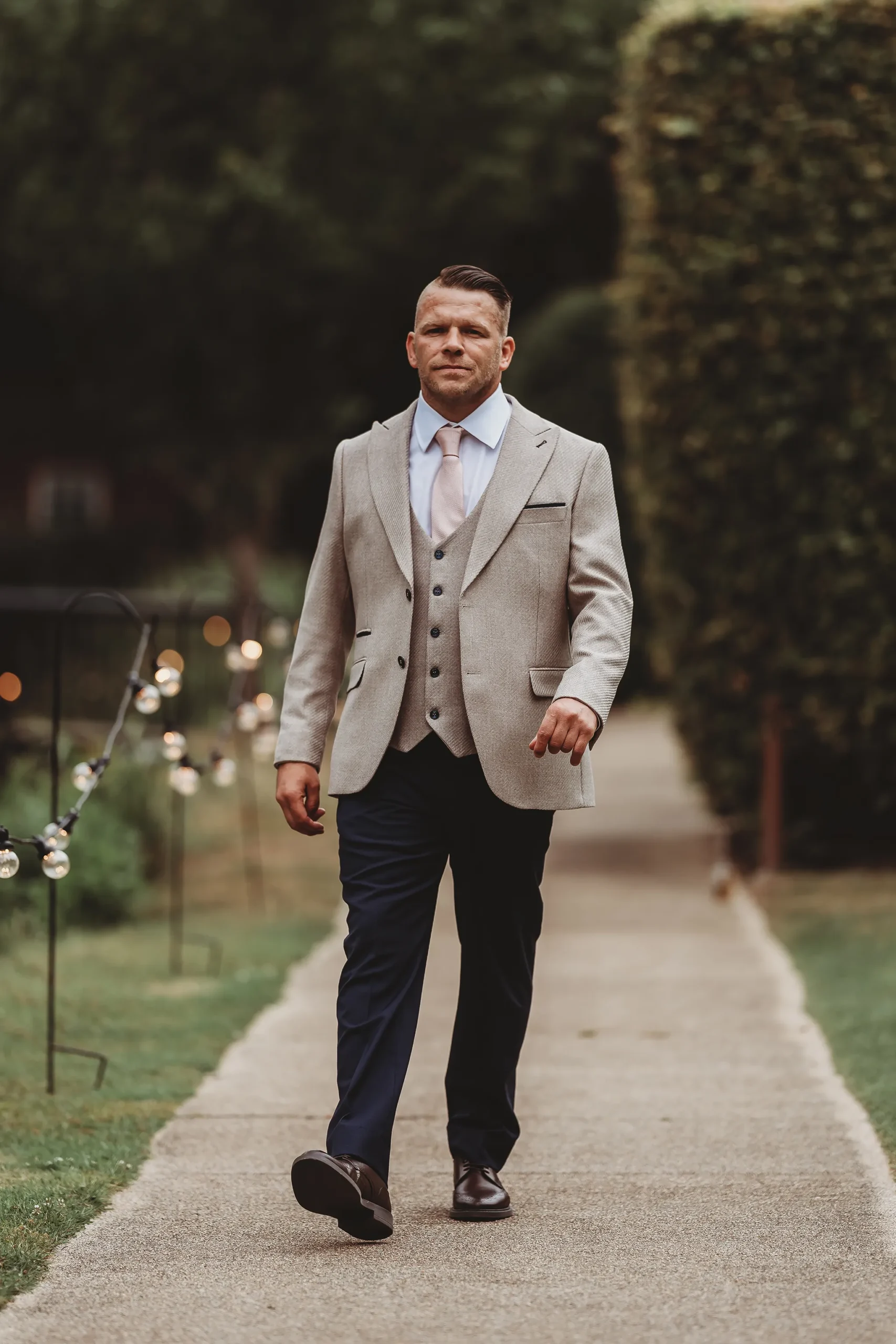 Emily & Alan / The Orangery 12 Groom Alan walking up the drive at The Orangery, Maidstone