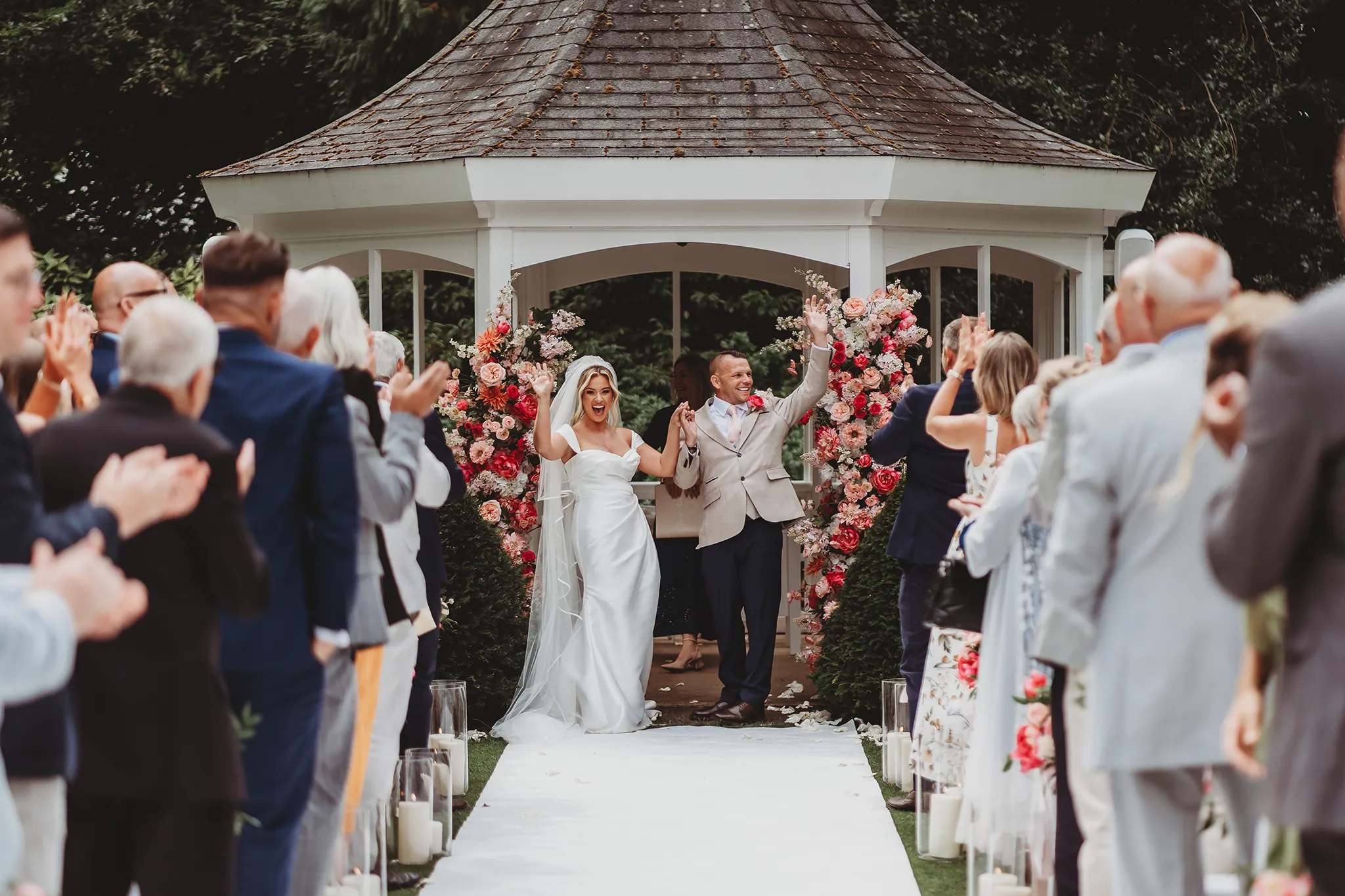 Emily & Alan / The Orangery 21 Emily and Alan walking back down the aisle as newlyweds