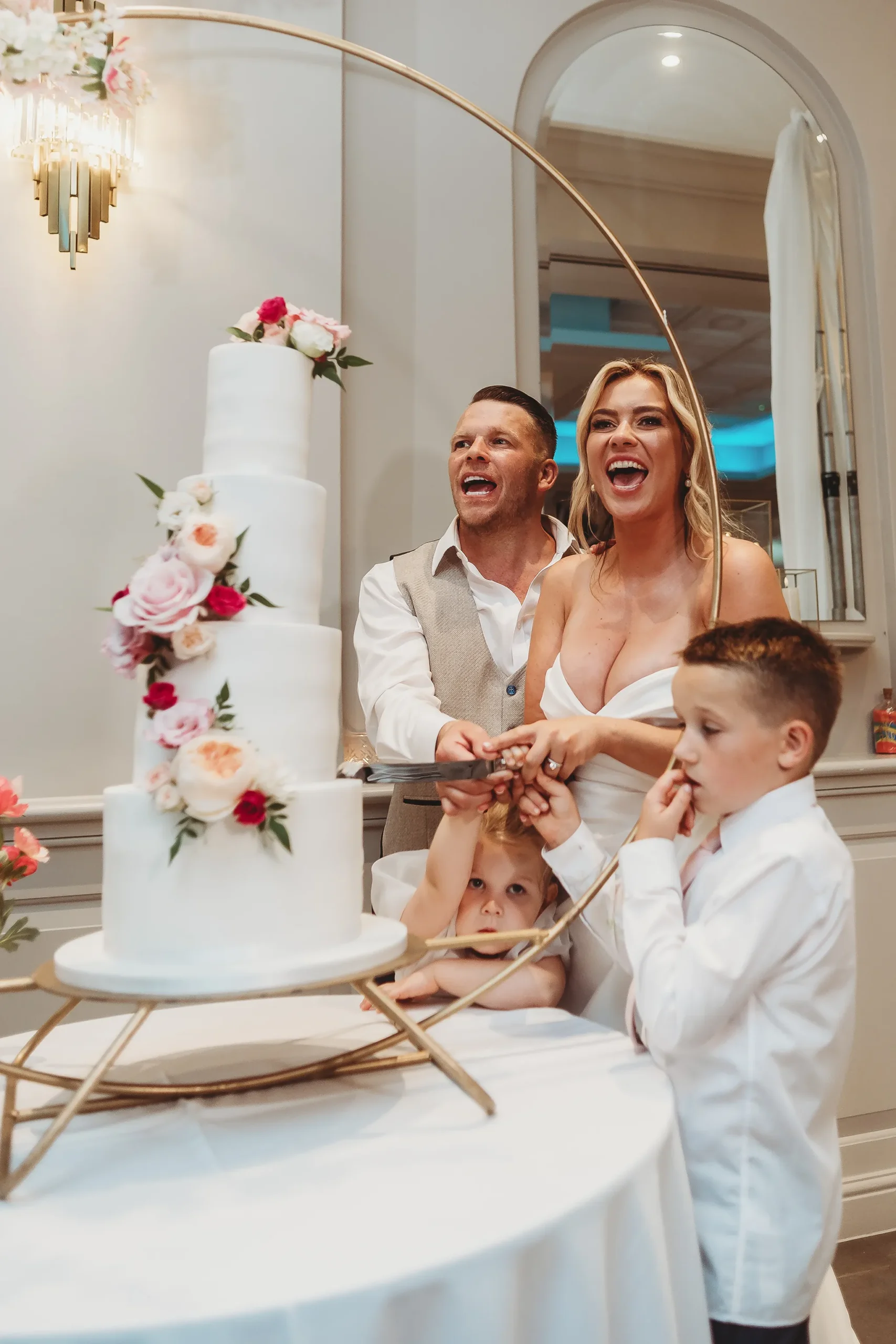 Emily & Alan / The Orangery 44 Emily and Alan cutting the cake with their little one