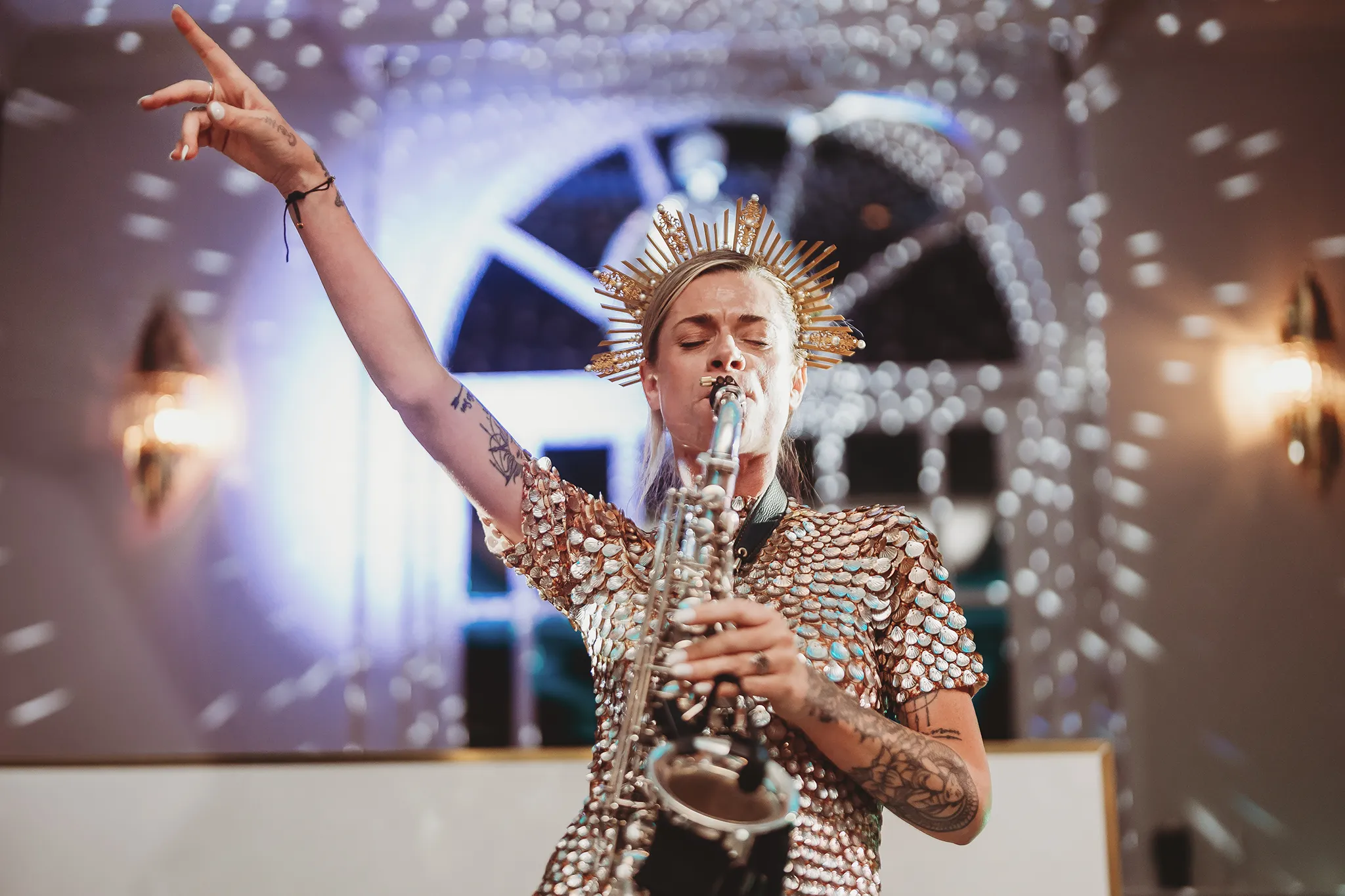Emily & Alan / The Orangery 48 Performer in a mirrored headdress on the dancefloor at The Orangery