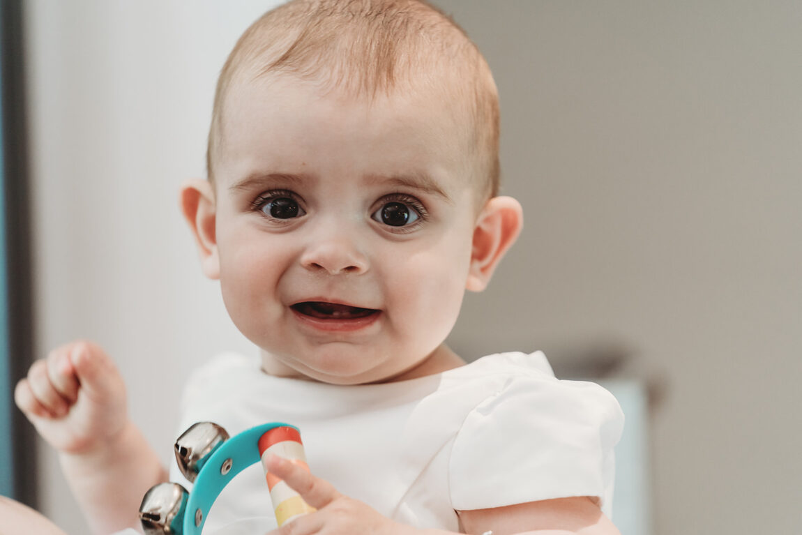 The youngest wedding guest smiling on the morning of the wedding