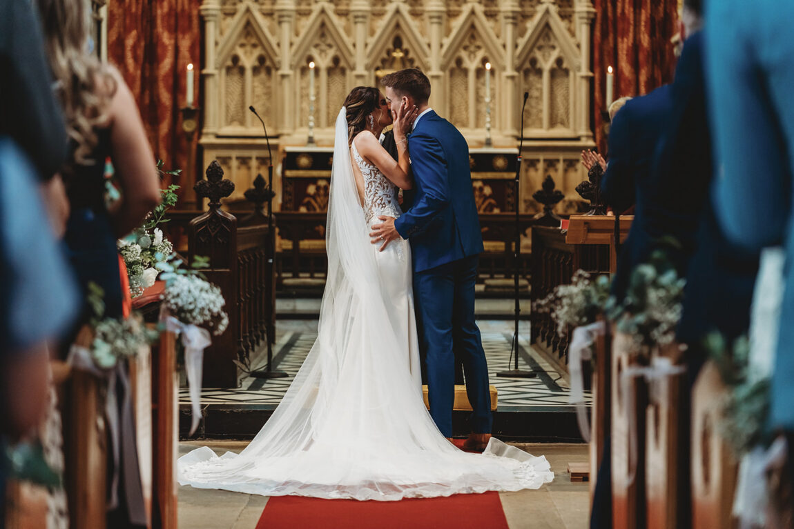 First kiss at the altar during the church ceremony