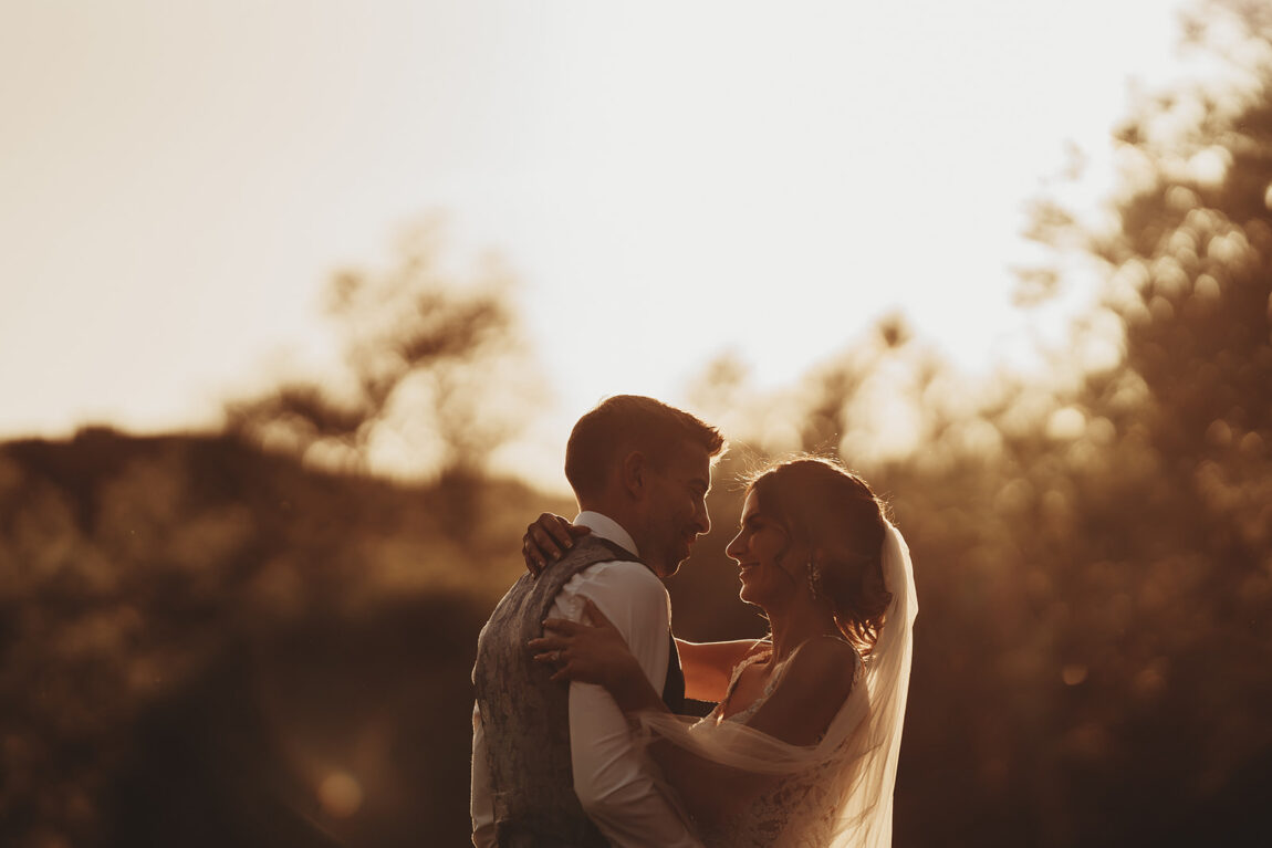 Couple at golden hour by the river at Le Talbooth, Dedham