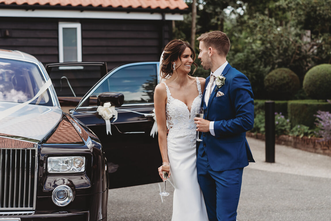Bride and groom arriving at Le Talbooth by Rolls-Royce