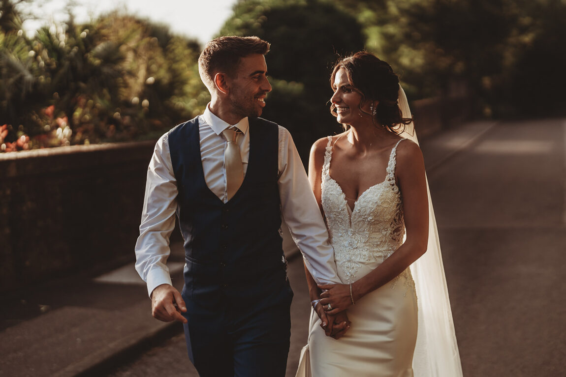 Couple walking together in the evening sun, Dedham