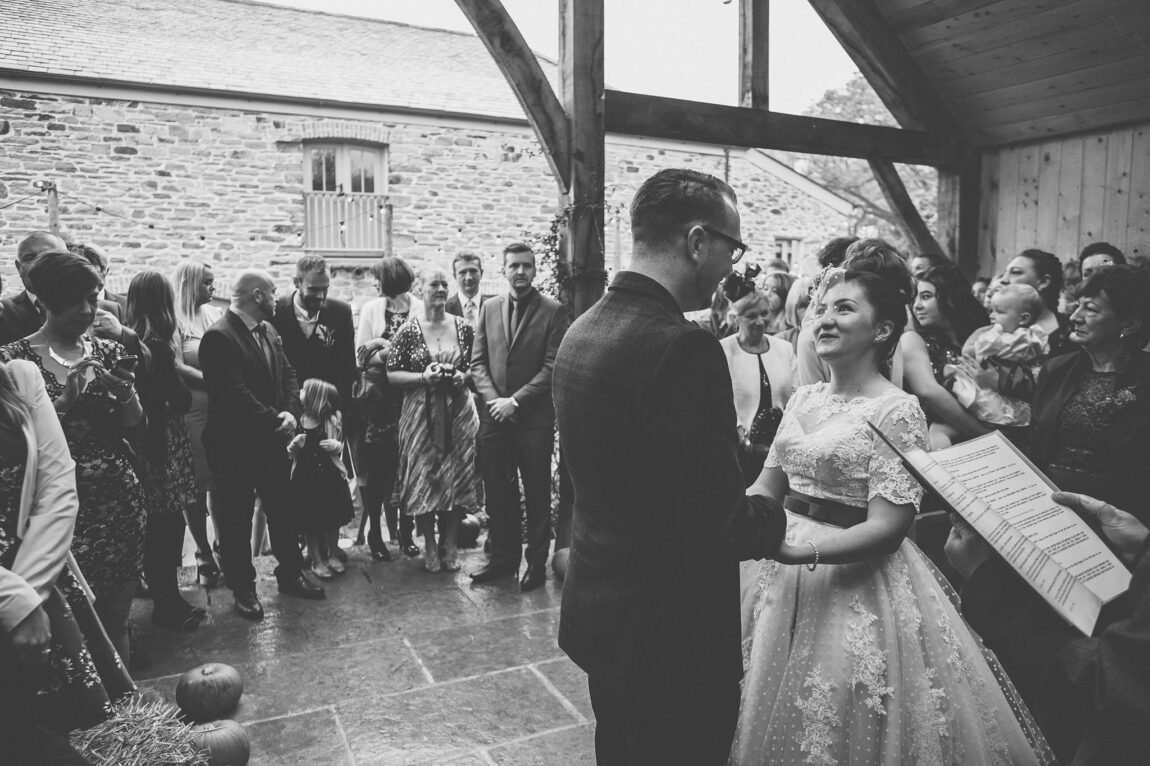 Black and white of the ceremony in the barn at Nancarrow Farm
