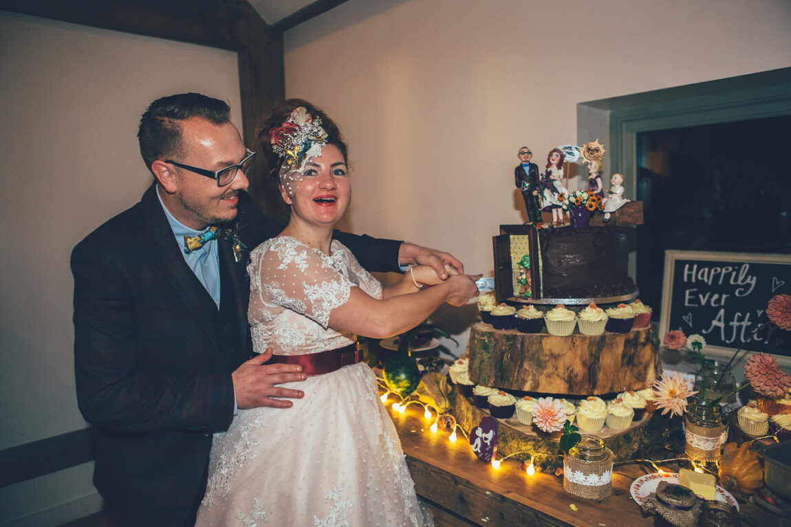 Bride and groom cutting the cake at Nancarrow Farm