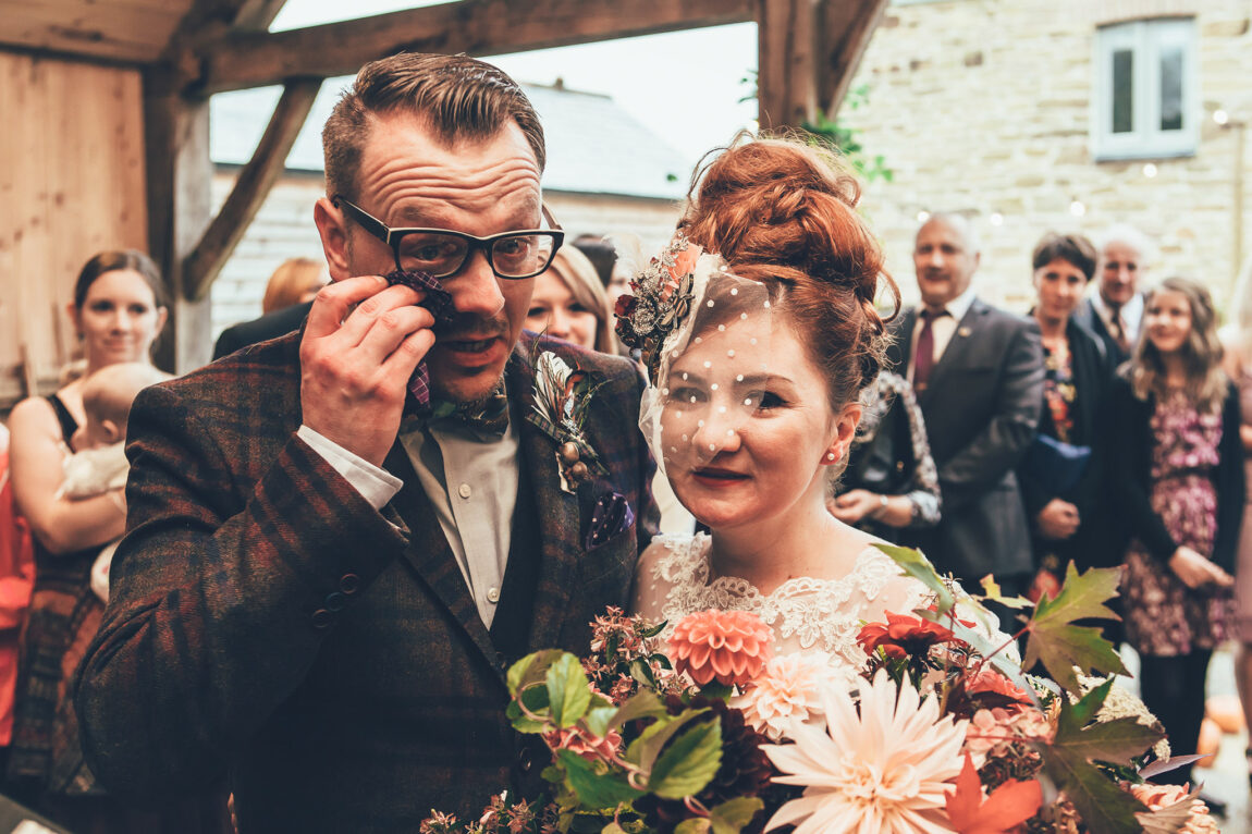 Groom wiping away a tear as the bride arrives at Nancarrow Farm
