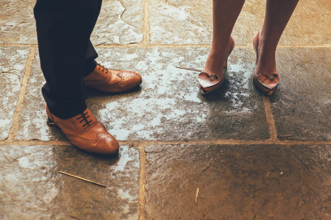 Wedding shoes on the stone floor of the barn at Nancarrow Farm