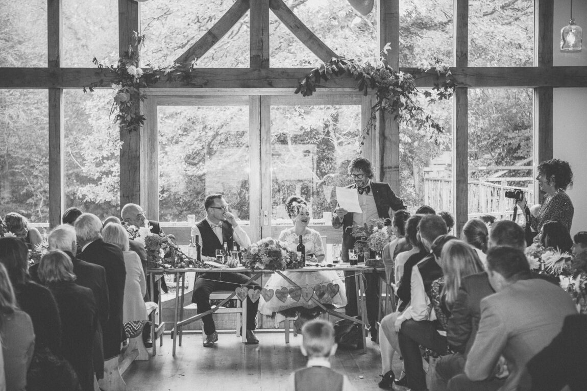 Black and white of guests at the wedding breakfast at Nancarrow Farm