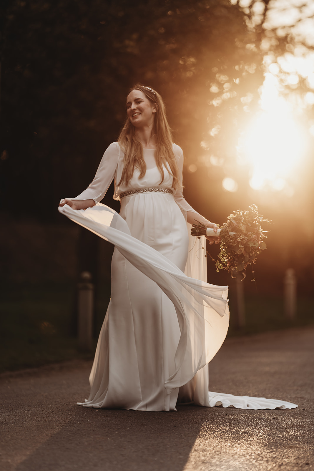 Kentisbury Grange wedding photographer Matt Wing, a photo from another wedding: bride twirling her dress at golden hour
