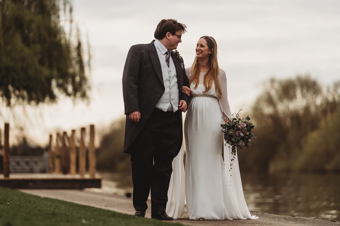 Couple walking along the Thames at Oakley Court