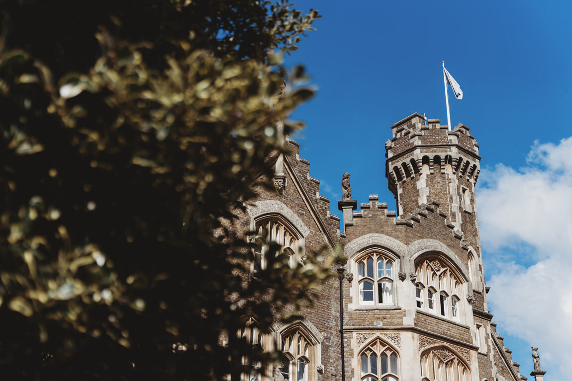 The tower at Oakley Court against a blue sky