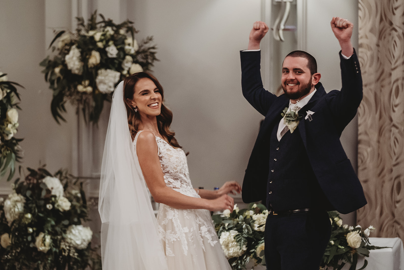Groom punching the air after the ceremony at Sopwell House