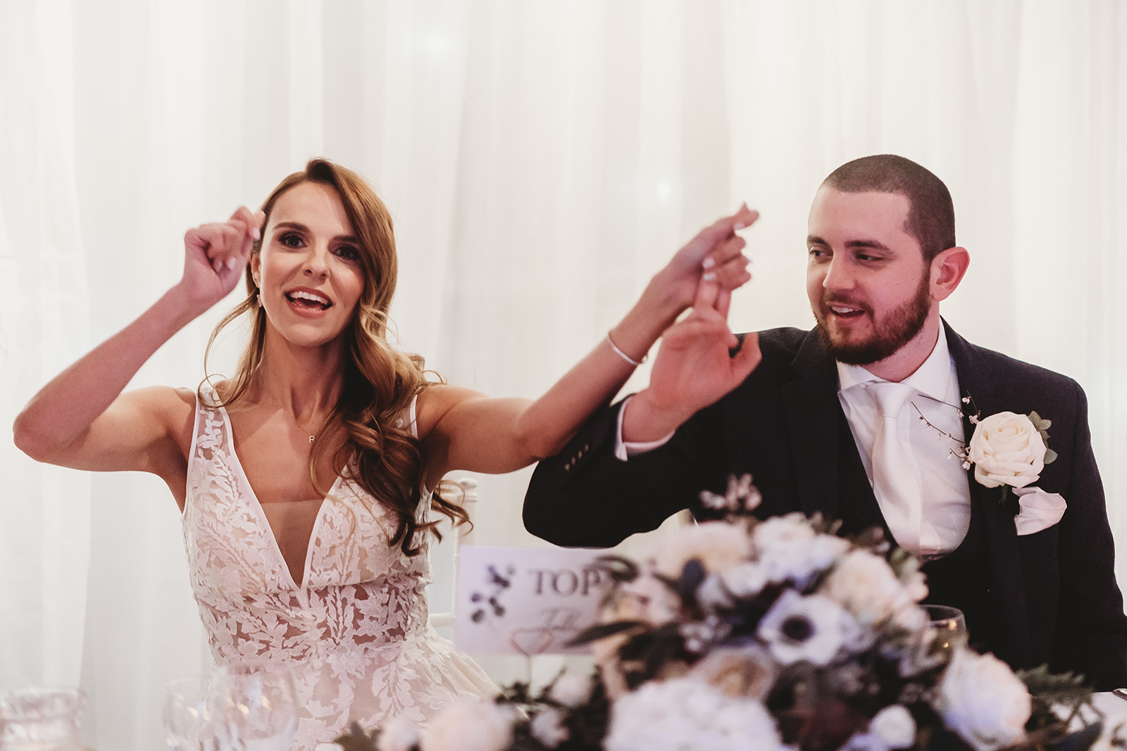 Bride and groom laughing during the speeches at Sopwell House