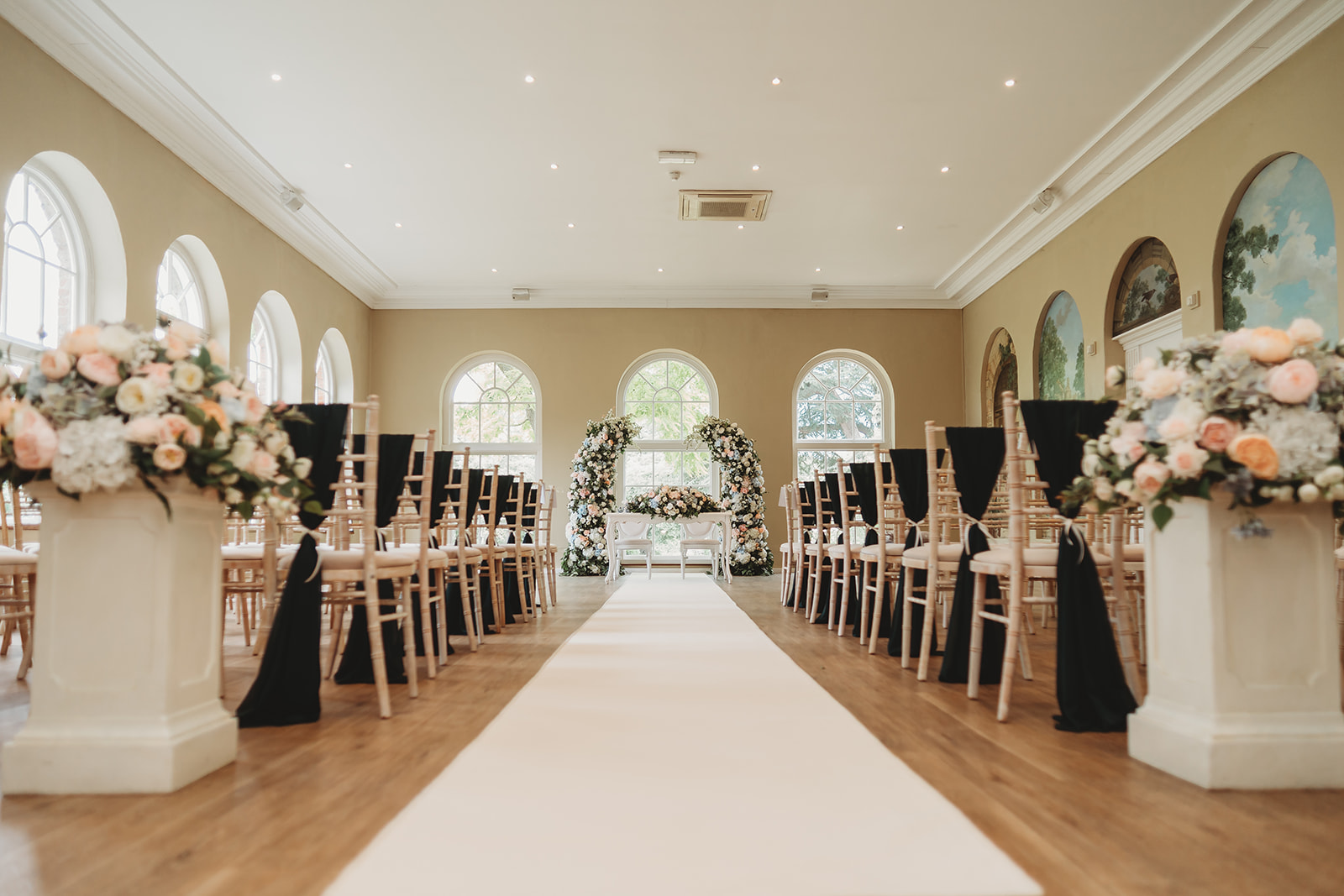 Wedding ceremony in the orangery at Braxted Park, Essex